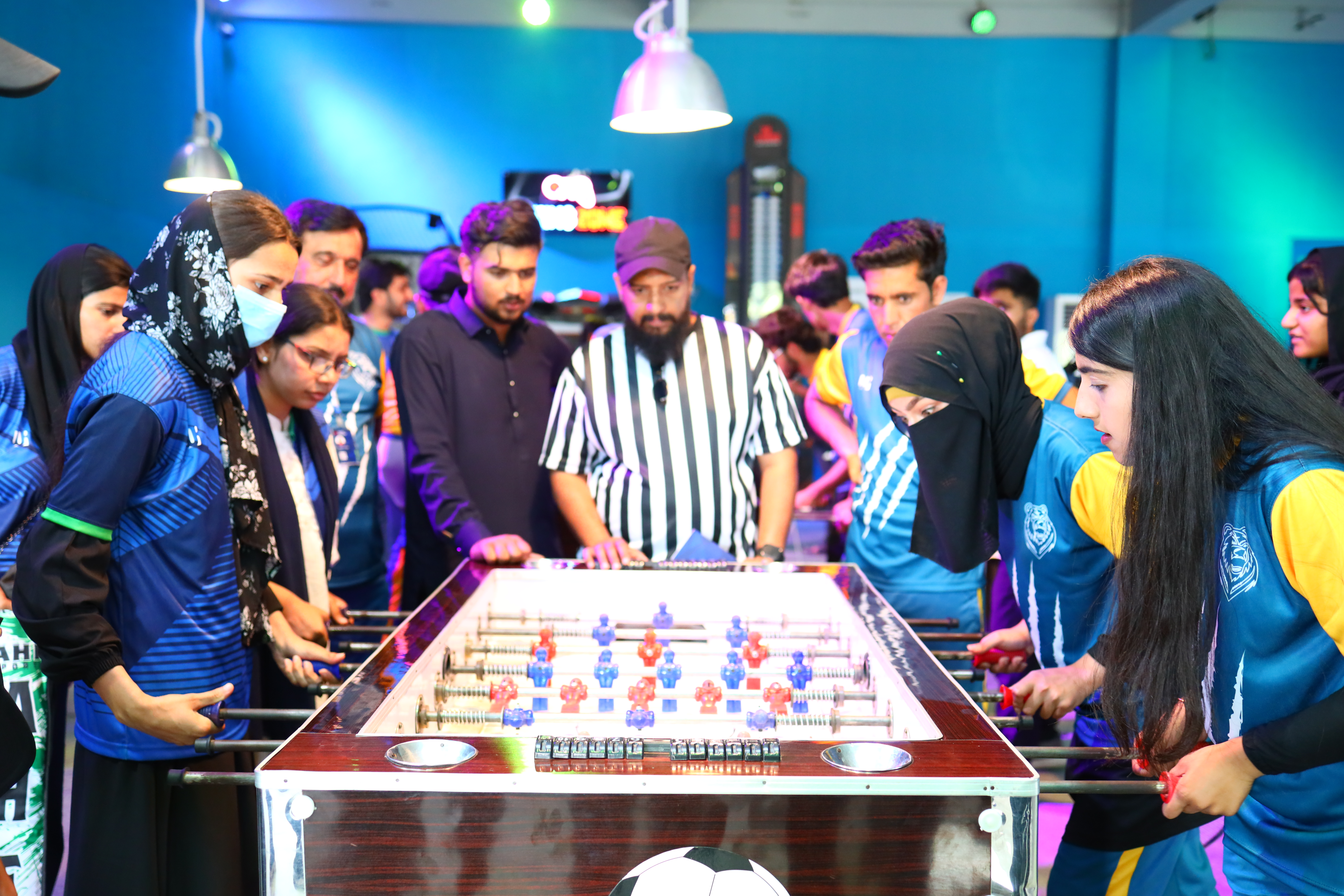 University of Rawalpindi students participating in an indoor foosball activity