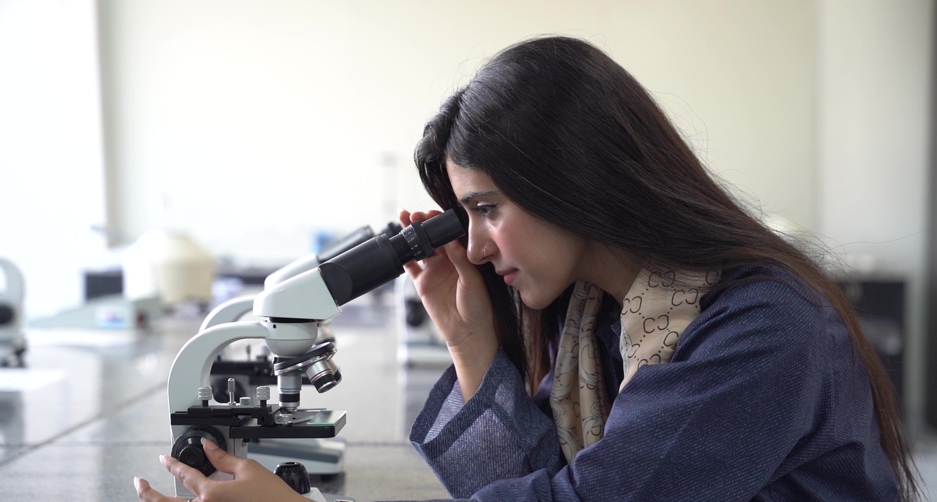 University of Rawalpindi student conducting laboratory research